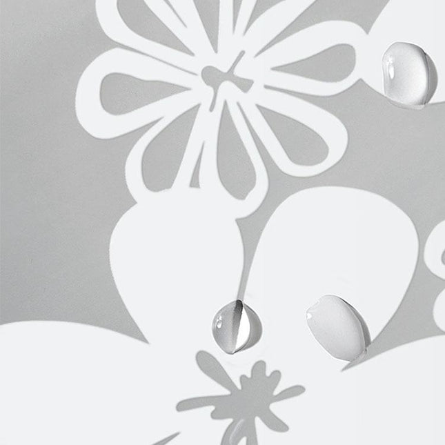 Halvtransparent duschdraperi med vita blommor